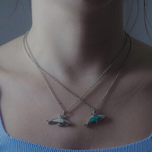 Aanyeh Charms' Shark Charm Necklace, filled with sand. A powerful symbol of strength and resilience. آنية.
